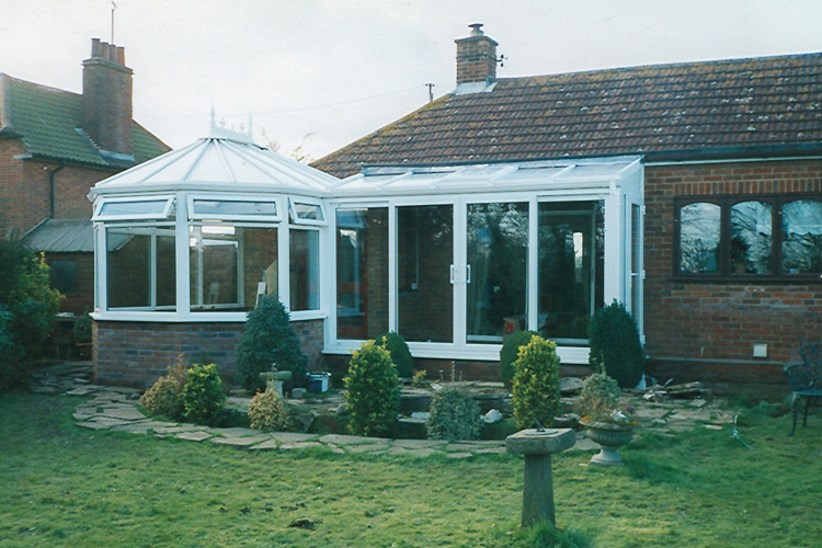 hite PVCu P Shape Combination Conservatory with 25mm Opal polycarbonate roof sheets & Patio doors