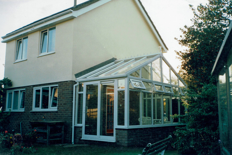 White PVCu Georgian Gable Conservatory with Solar control self cleaning roof & white PVCu Patio doors