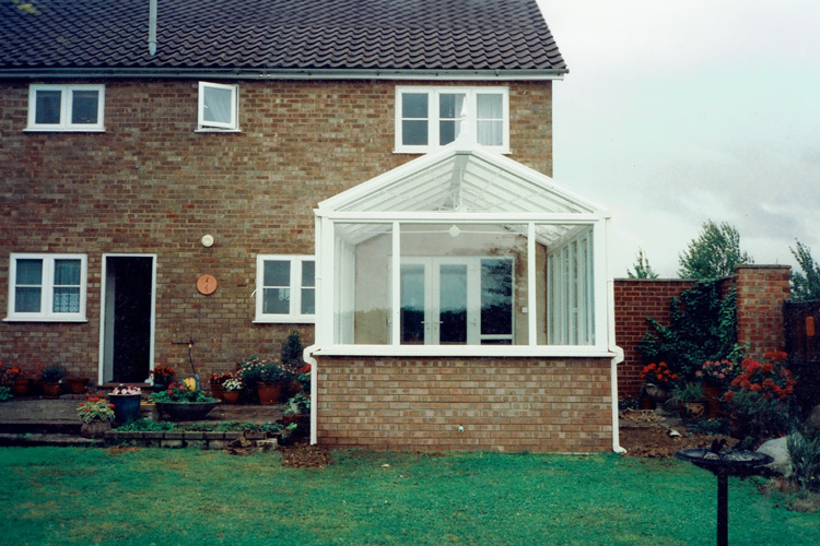 White PVCu Georgian Gable Conservatory with Opal polycarbonate roof & white PVCu French doors