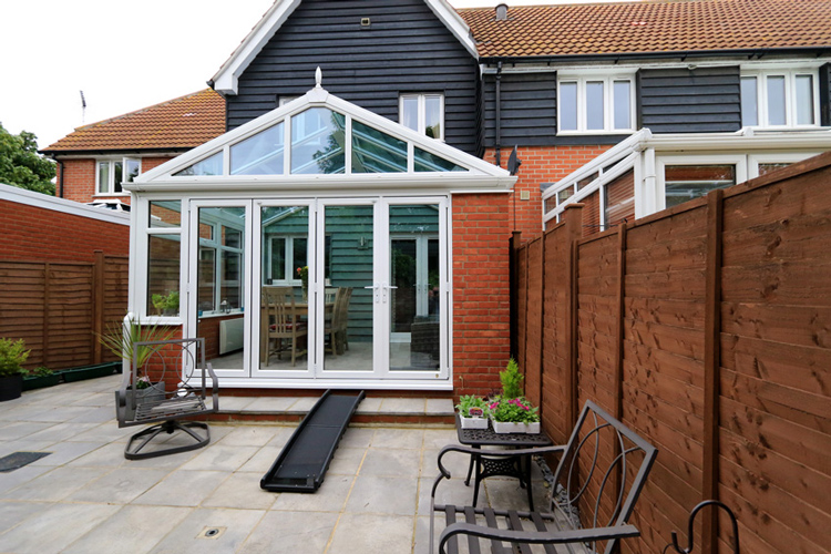 White PVCu Georgian Gable Conservatory with Solar control self cleaning roof & white PVCu BI-Folding doors