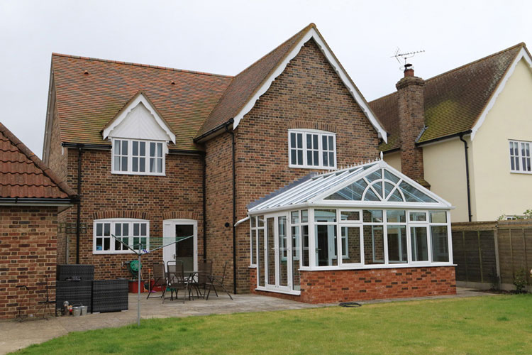 White PVCu Georgian Gable Conservatory with Solar control self cleaning roof & white PVCu French  doors
