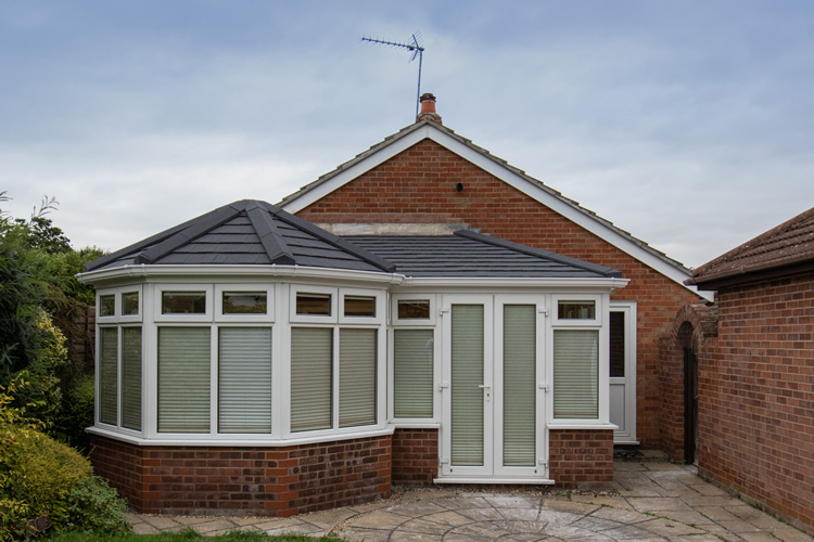 P Shape Combination with Metrotile Charcoal tiles, utilizing existing existing windows & door