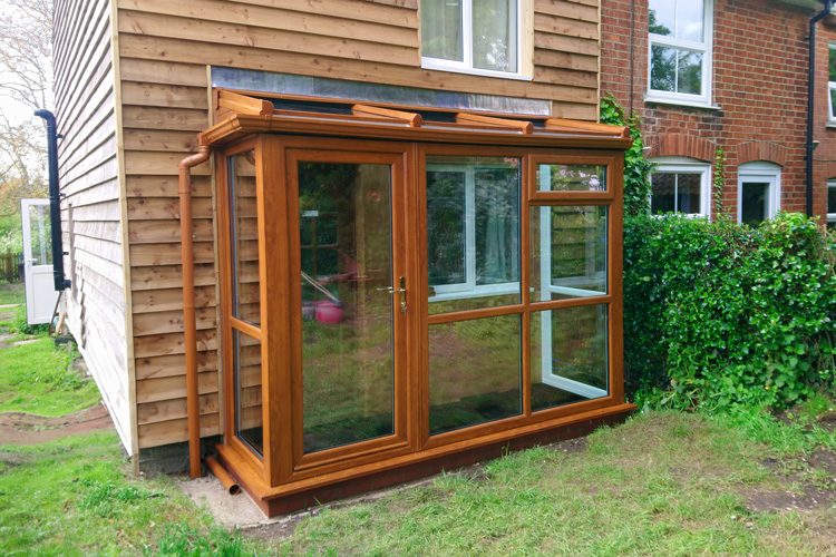 Oak PVCu Lean-To Conervatory with solar control self cleaning glass roof sheets, single door & glass to floor