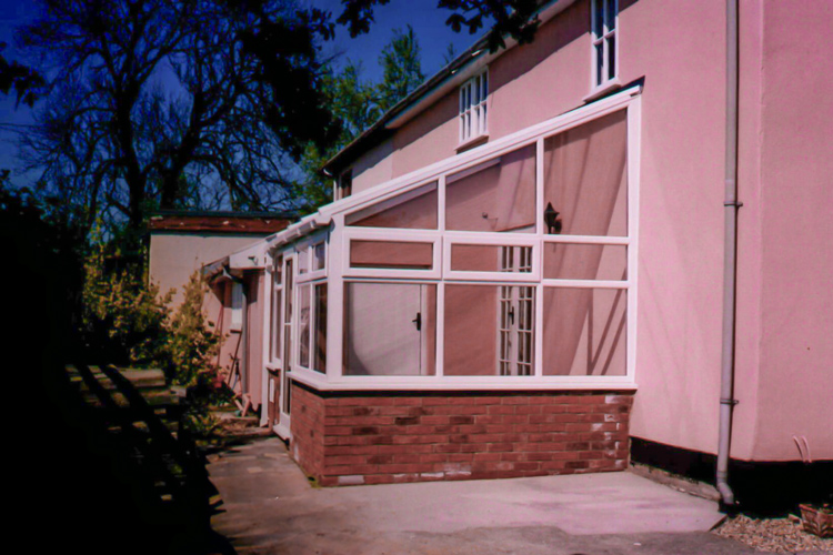 White PVCu Lean-To Conervatory with Polycarbonate roof sheets, French doors & 600mm dwarf wall