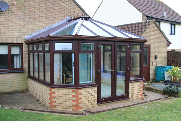  Rose wood effect PVCu Victorian Conservatory with unequal bays